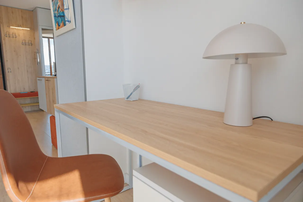 Dedicated workspace beside a panoramic window