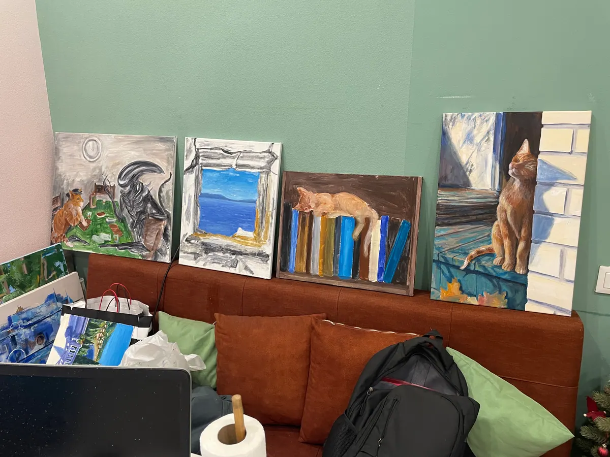 Four artworks photographed together during creation